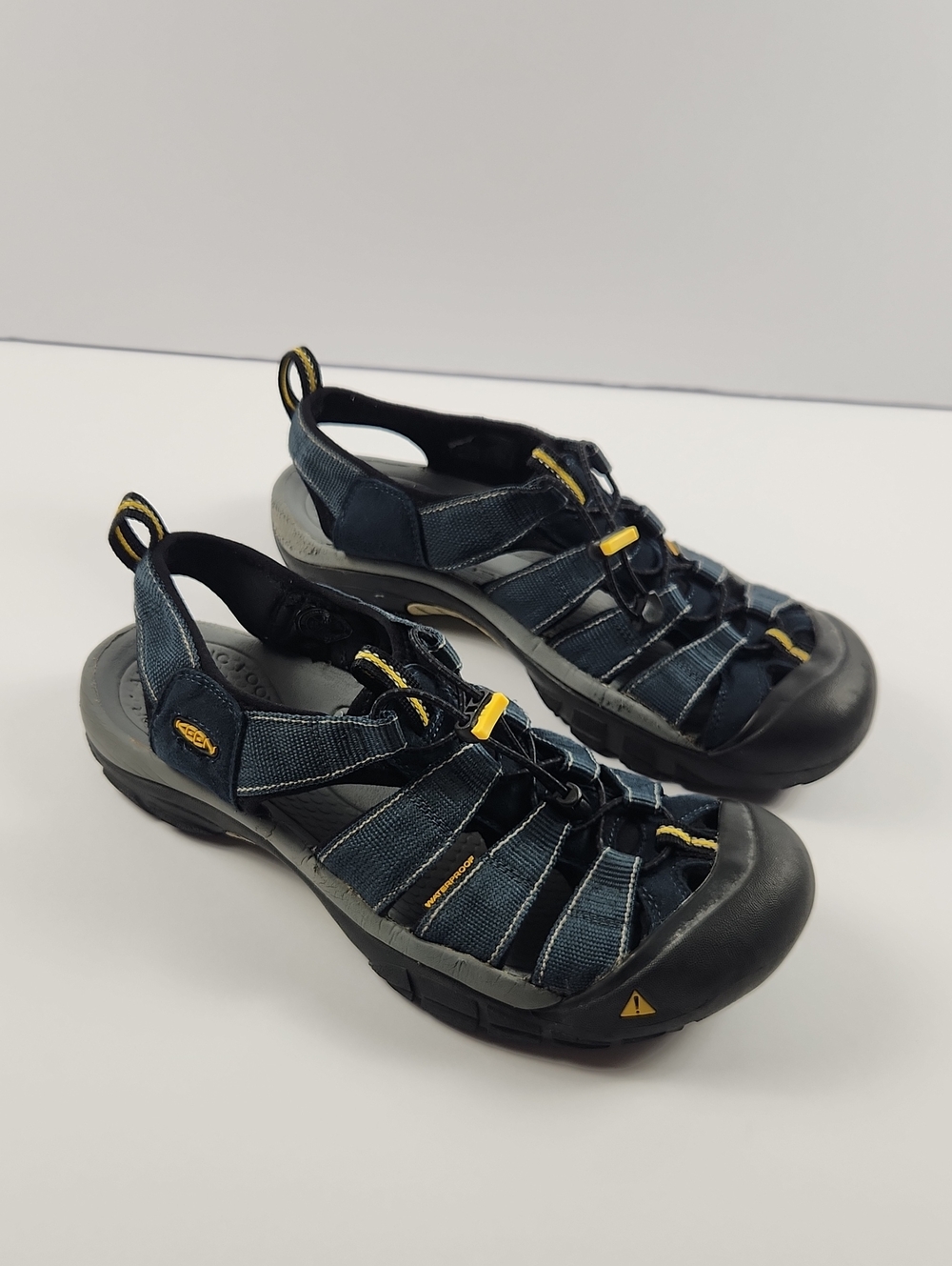 Keen Men's Dark Blue and Black Closed-Toe Outdoor Sandals with Yellow Accents